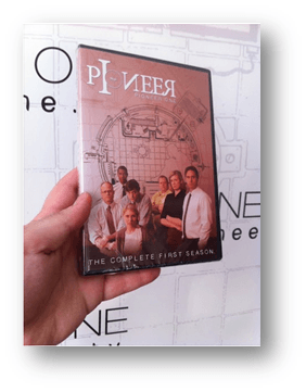 a hand holds up a DVD case for the bitcoin funded Pioneer One TV series